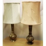 Two engraved Indian/Persian brass table lamps and shades, H. 75cm.