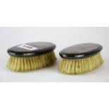 A pair of 800 silver backed brushes.