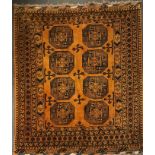 A Persian handwoven gold ground wool rug, size 153 x 206cm.