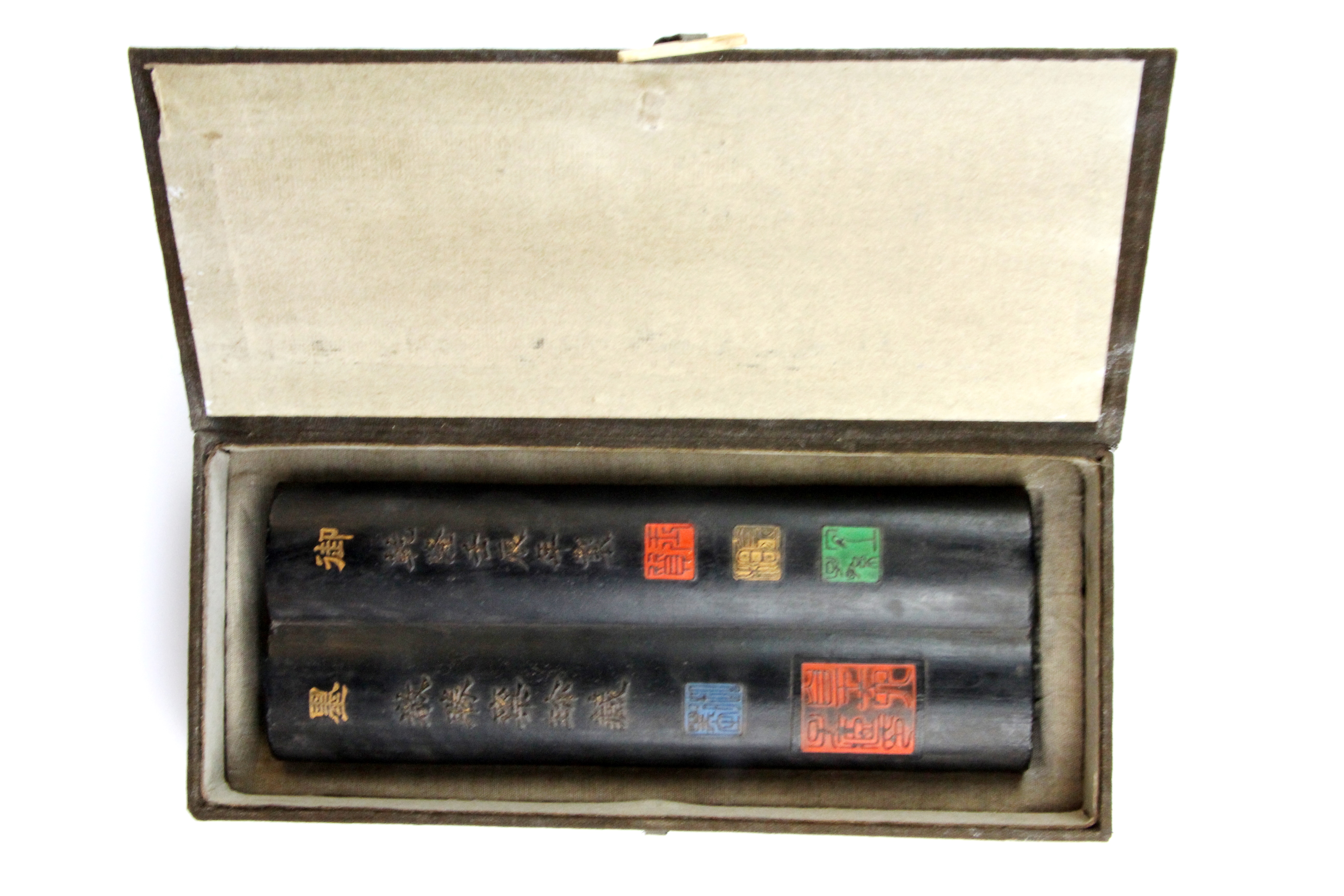 A Chinese cased presentation calligrapher's ink block. L. 22cms.