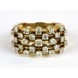 A yellow metal (tested 18ct gold) diamond set ring, (M).