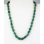 A polished jade bead necklace on a 925 silver gilt clasp, L. 40cm.