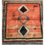 A heavy quality hand woven wool rug, size 2m x 2m.
