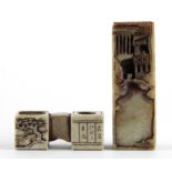 Two 1920's Chinese carved soapstone scholars seals in the form of elaborate ink grinding stones,