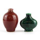 Two Chinese porcelain green and red glazed snuff bottles, tallest 7cm.