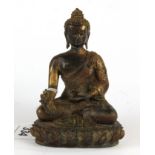 A small Chinese bronze figure of a seated Buddha, H. 12.5cm.