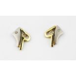 A boxed pair of 14ct yellow and white gold (stamped 585) diamond set stud earrings, L. 1.2cm.