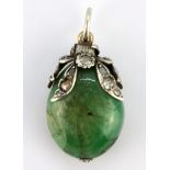 A white metal pendant set with a large emerald and old cut diamonds, L. 4cm, W. 2cm.