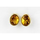 A pair of 9ct yellow gold citrine set stud earrings, L. 1cm.