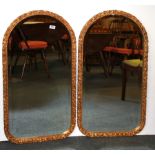 A pair of gilt framed arched mirrors, W. 51cm H. 97cm.