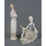 Two Lladro figures of young ladies with animals, tallest 28cm.