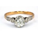 An 18ct yellow and white gold (stamped 18ct) brilliant cut diamond set solitaire ring, approx. 1.