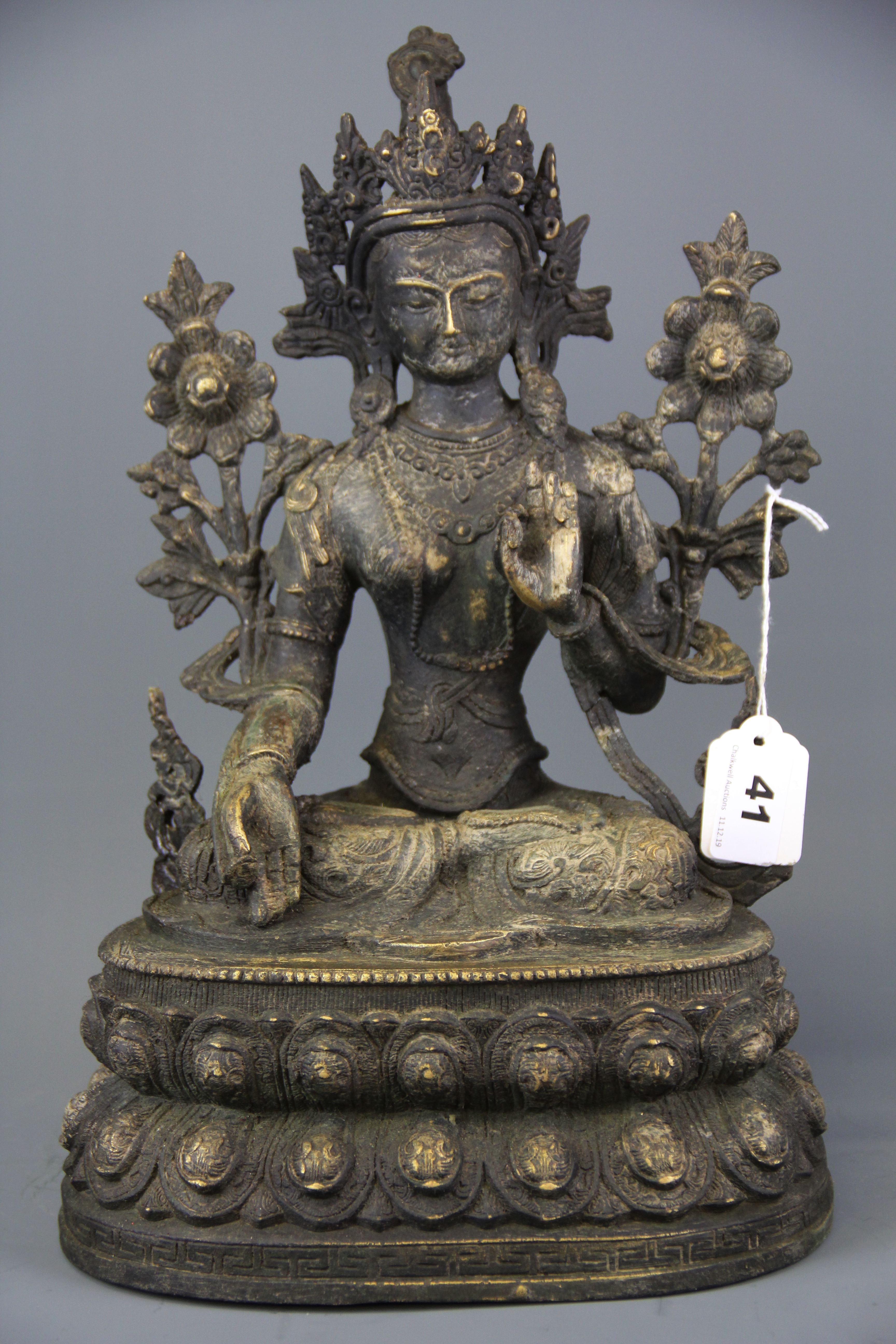 A Tibetan bronze figure of the seated Tara, H. 35cm.