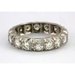 A white metal (tested high carat gold) full eternity ring set with brilliant cut diamonds, approx.