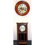 A Victorian oak cased circular alarm clock together with an oak wall clock.