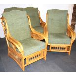 A green velvet upholstered 1930's bergere suite comprising of a two seater settee, two armchairs and