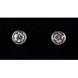 A pair of 9ct white gold (stamped 375) diamond set stud earrings approx. 0.40ct overall.