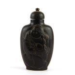 A Chinese carved horn snuff bottle of the Happy Buddha with a carved horn stopper, H. 9cm.