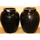 A large pair of early Chinese Honan glazed stoneware vases, H. 38cm, Dia. 28cm.