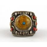 A Tibetan white metal stone set tribal man's ring, (U).