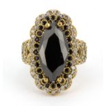 A 925 silver gilt ring set with black and white stones, (P.5).
