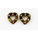 A boxed pair of 9ct yellow gold heart shaped stud earrings set with brilliant cut diamonds, L. 1cm.