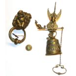A brass lion door knocker and Angelus bell, knocker H. 20cm.