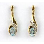 A pair of boxed 9ct yellow gold drop earrings set with oval cut blue topaz and diamonds, L. 2.2cm.