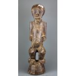 An African carved wooden Tribal figure, H. 55cm.