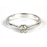 An 18ct white gold (stamped 750) diamond solitaire ring. Approx. 0.25ct estimated VS (M), W. 2.2g.