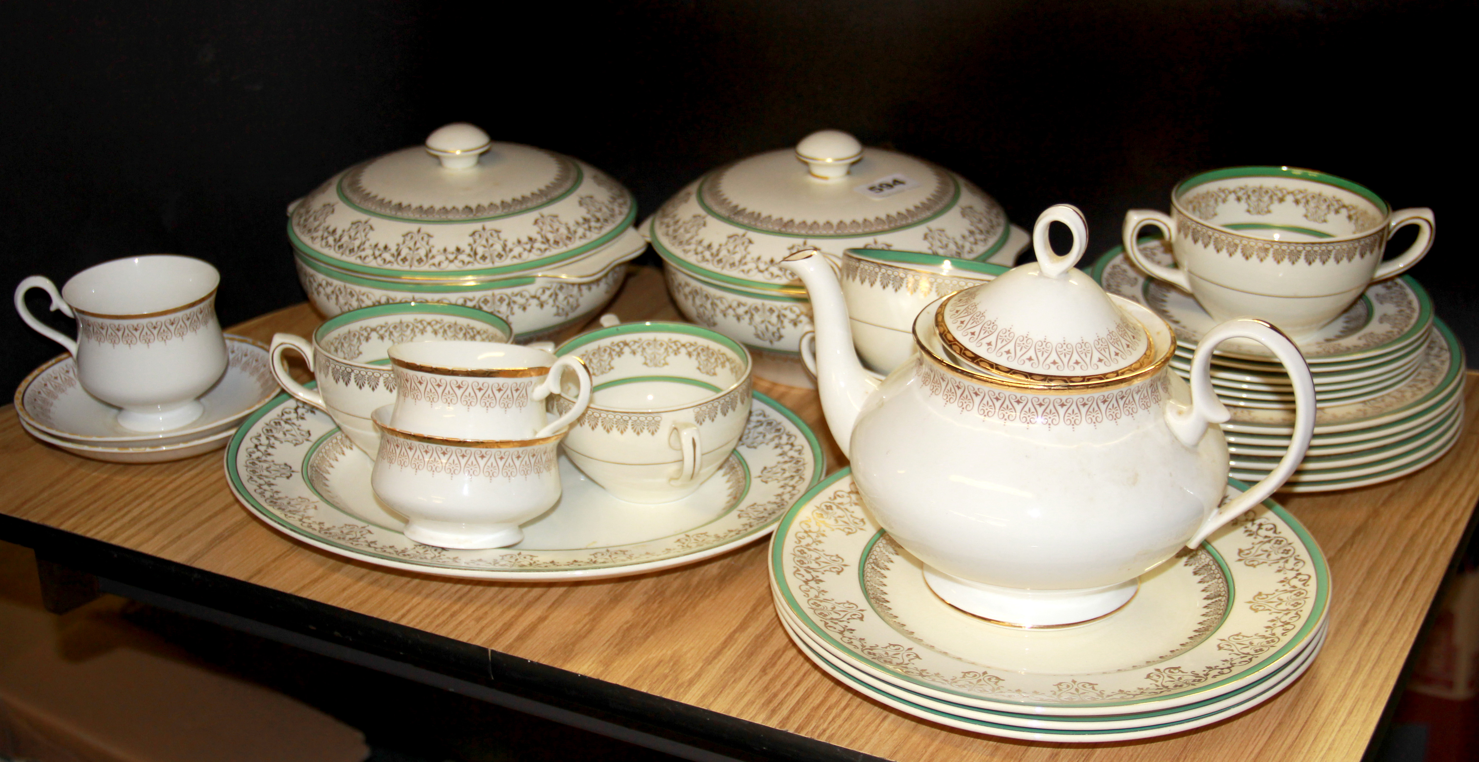 A Wedgwood dinner service together with a Royal Albert Burlington pattern part tea set.