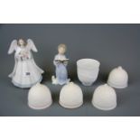 A Lladro figure of an angel playing a lute, Lladro figure of a singing cherub, four Lladro