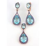A pair of 925 silver rose gold gilt drop earrings and matching pendant set with blue stones, L.
