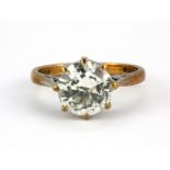 A 9ct yellow gold stone set solitaire ring, (L.5).