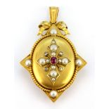 A Victorian yellow metal (tested 18ct gold) locket pendant set with rubies, diamonds and pearls,