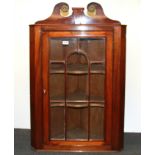 A Regency mahogany veneered corner cabinet, W. 67cm H. 106cm.