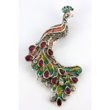 A 925 silver and marcasite enamelled peacock shaped brooch / pendant set with pear cut rubies, 6.5 x