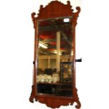 A Georgian ornately carved mahogany mirror, size 84.6 x 33cm.