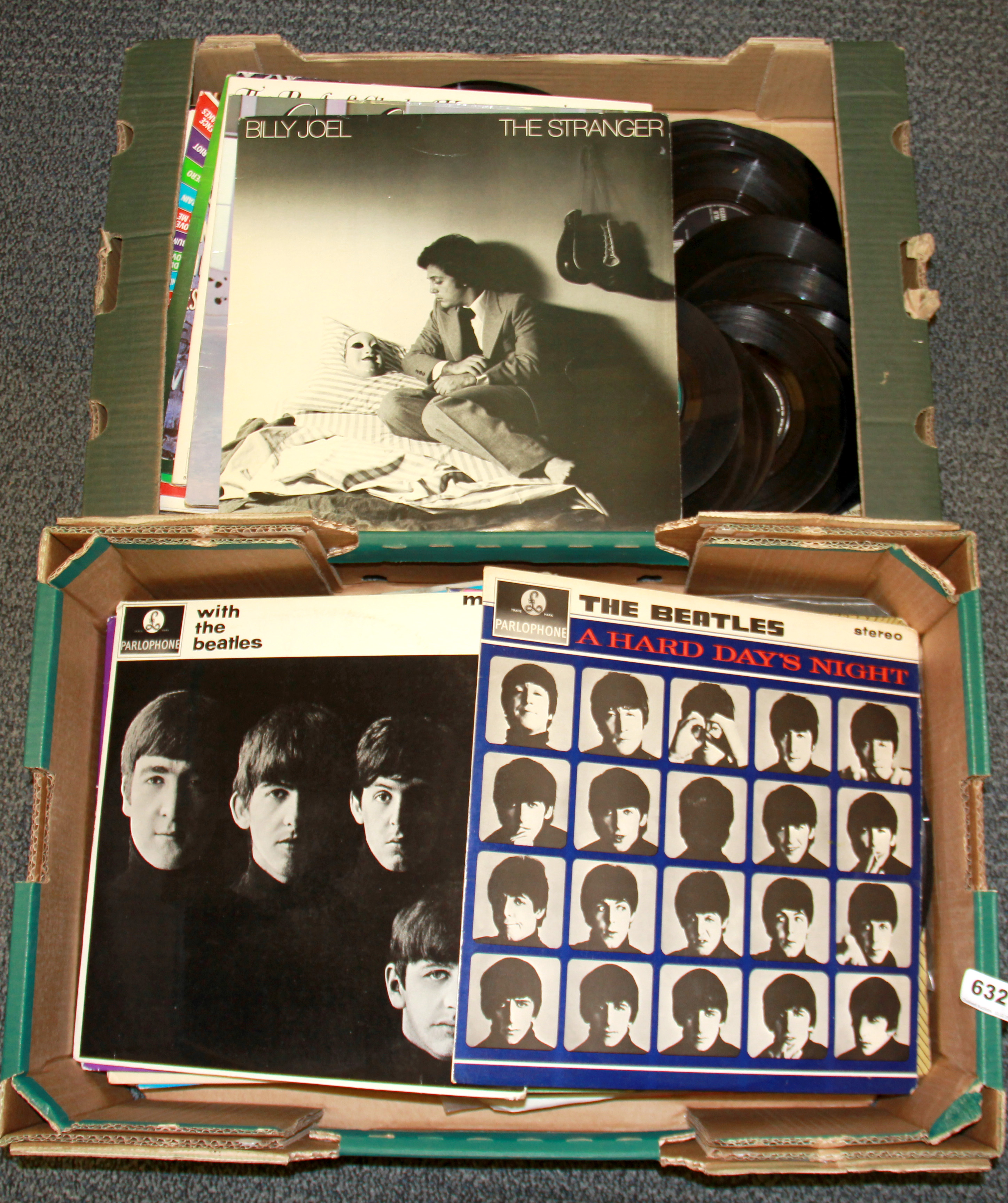 A quantity of Beatles and other LP records and singles.