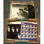 A quantity of Beatles and other LP records and singles.