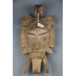 An African carved wooden Tribal mask, size 48 x 22cm.