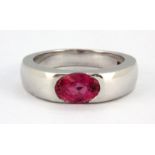 An 18ct white gold ring set with an oval cut pink tourmaline, (H).