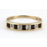 A 9ct yellow gold sapphire and diamond set ring, (Q).