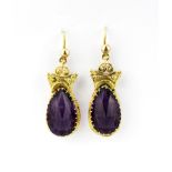 A pair of Victorian yellow metal (tested 14ct gold) drop earrings set with faceted cut amethysts,