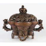 A mid 20th Century Chinese cast copper bronze censer with lion dog handles and bamboo feet, H. 23.