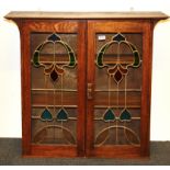 An oak and leaded glass fronted wall display cabinet, size 92 x 27 x 88cm.