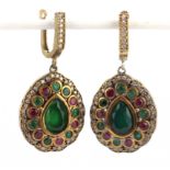 A pair of eastern antique 925 silver gilt earrings set with rubies and green stones, L. 5cm.