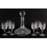 A 1982 Thomas Webb cut crystal hallmarked silver rimmed decanter together with six glasses.