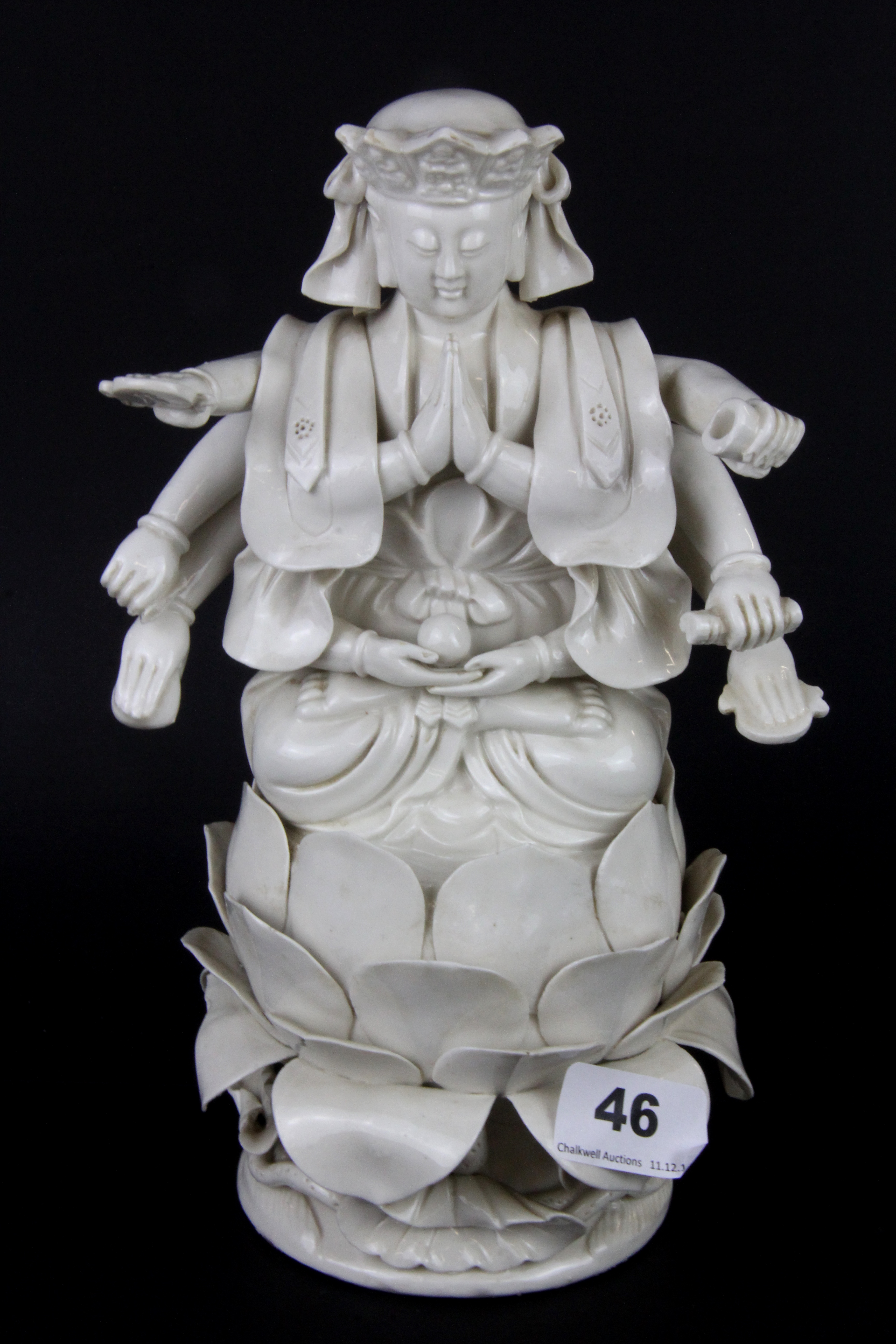 An early 20thC Tibetan blanc de chine glazed ceramic figure of a multi armed deity, H. 26cm. - Image 4 of 4