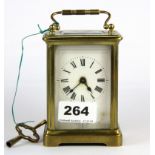 A brass carriage clock, H. 11cm.